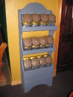 12-jar wooden display rack Auction Photo