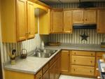 ARISTOKRAFT CABINETRY BIRCH W/ FAWN STAIN LAMINATE COUNTERTO Auction Photo