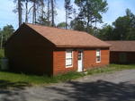 Repair Facility Restaurant (4) - Rental Cabins (2) Bldg. Lots - Rolling Stock & Shop Equip. Auction Photo