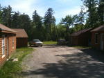 Repair Facility Restaurant (4) - Rental Cabins (2) Bldg. Lots - Rolling Stock & Shop Equip. Auction Photo