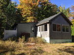  1BR Cottage – 5.2+/- Acres - Beech Hill Pond Access  Auction Photo