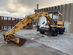 1986 CAT 206 RUBBER TIRED EXCAVATOR Auction Photo